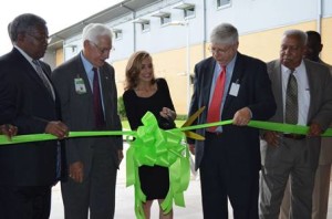 TCTA Principal Kathleen Hughston (center) cuts the ribbon on the new facility as Superintendent Dr. Paul McKendrick (left), board members Harry Lee, Dan Meissner and James Minyard look on.