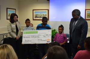 Martin Luther King, Jr. Elementary School students present a check to the United Way for $957.18 Tuesday as part of the annual campaign